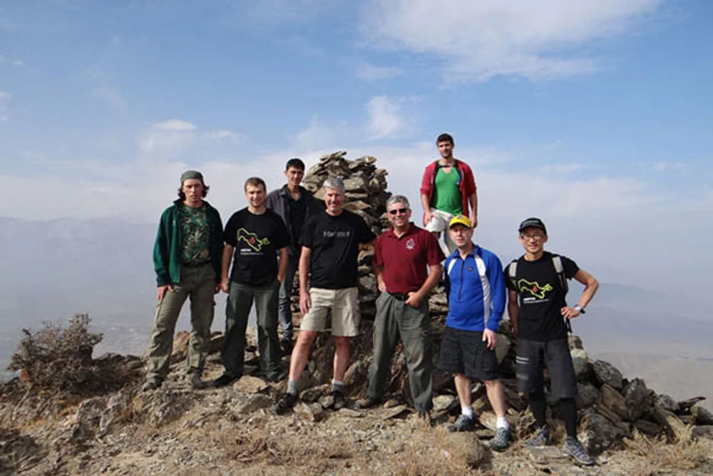 Hiking in the Nuratau Mountains above a traditional village — Uzbekistan community-based tourism