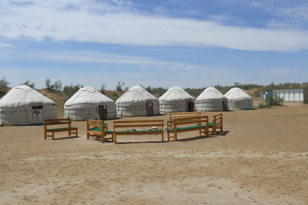 A camp of felt yurts in the desert near the Aral Sea
