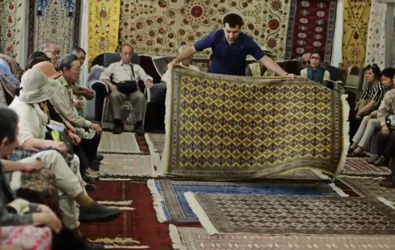 Silk carpets displayed in the Samarkand carpet factory showroom